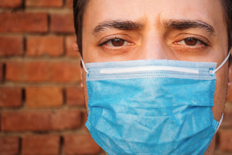 Close-up of a man with a medical face mask