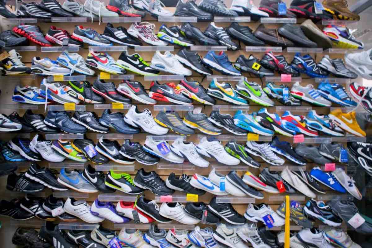 A thrift store that is teeming with shoes