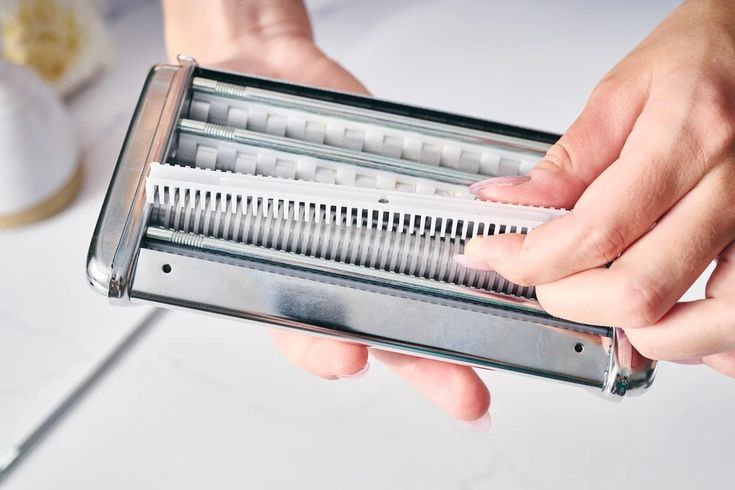 A disassembled pasta machine 