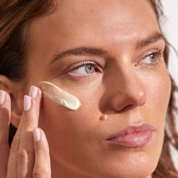 Woman Applying Sunscreen