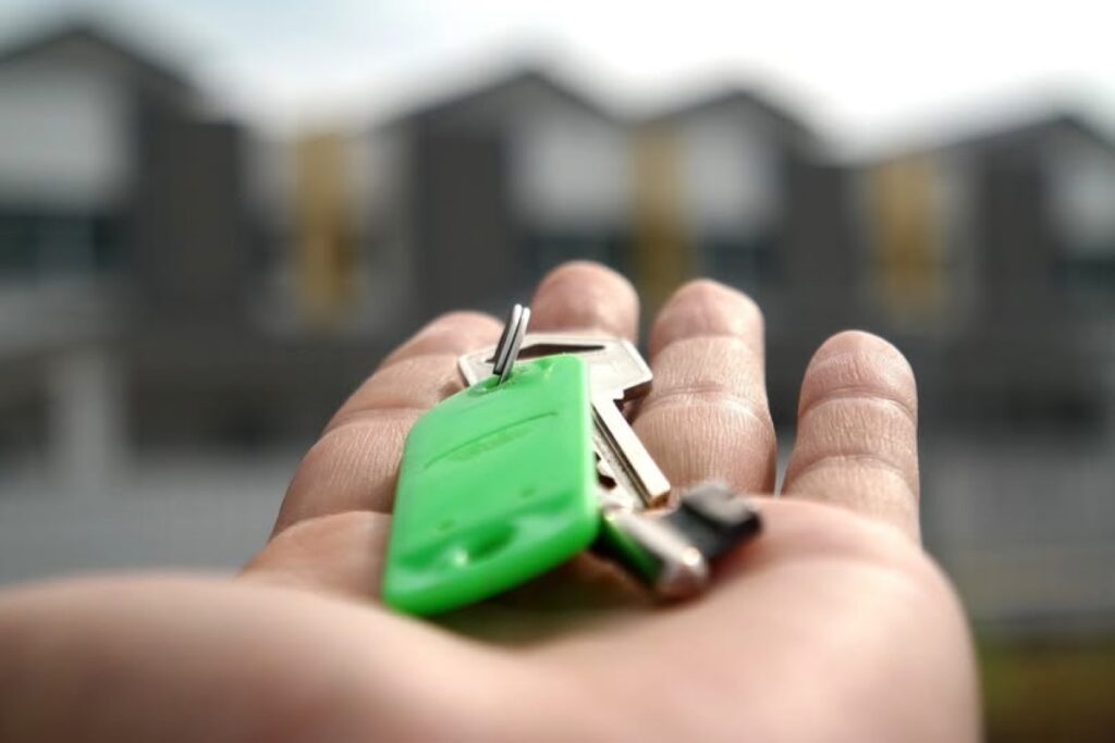 An open palm with keys to an apartment