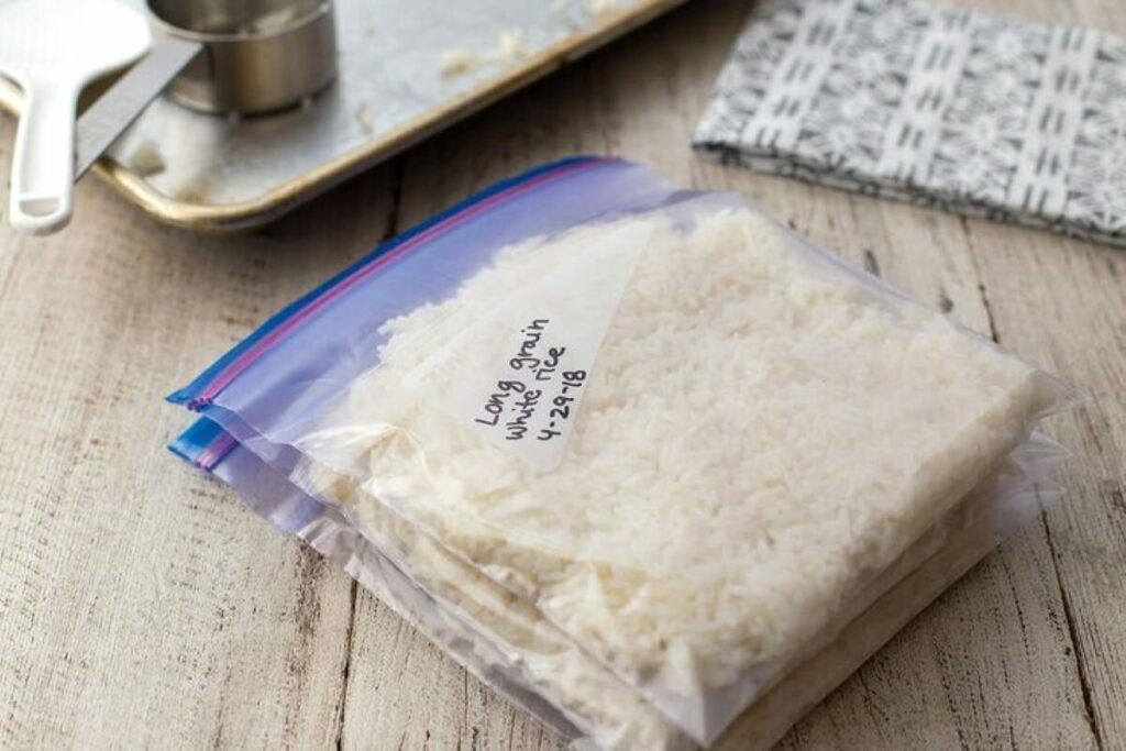 Three stacks of cooked rice readied for freezing