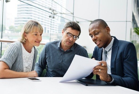 Men and woman gathering documents