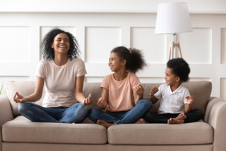 Mother and children having meditation moment