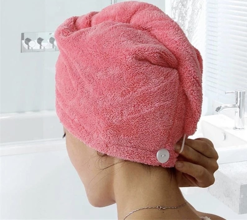 a woman with a towel on her hair