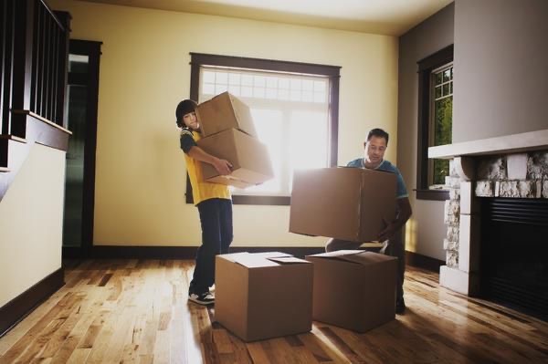 An image of people moving boxes