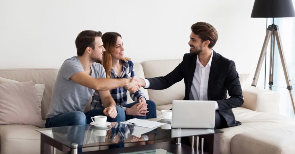 A property manager interacting with a couple