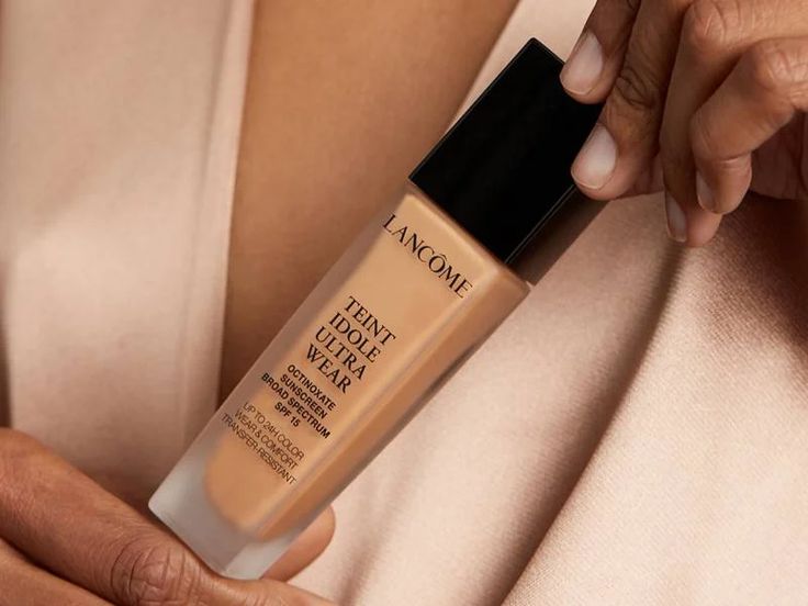 Woman holding a Hydrating Foundation