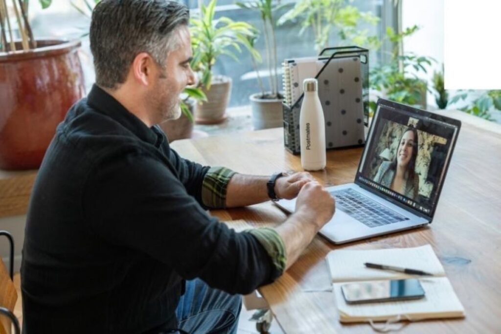 A man having a virtual meeting with a client