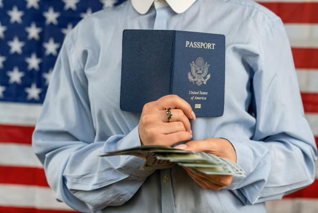 Beautiful woman holding a passport with money