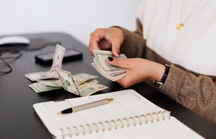 Woman Paying Herself Before Spending