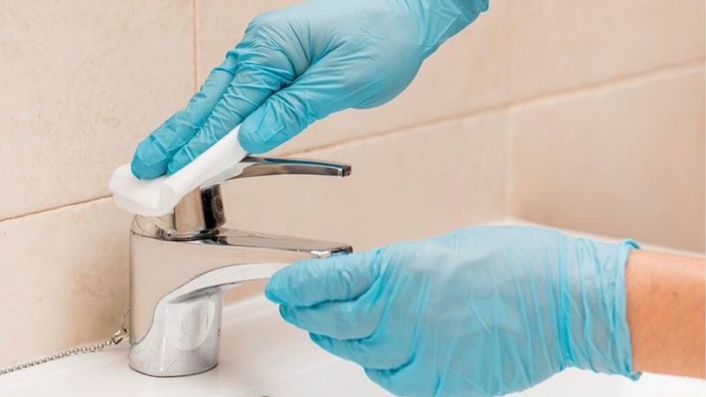 Person maintaining porcelain sink