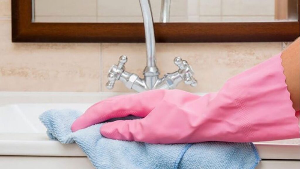 Person Protecting sink from scratches and damages