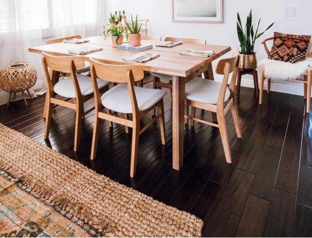 A dining room with a small area rug