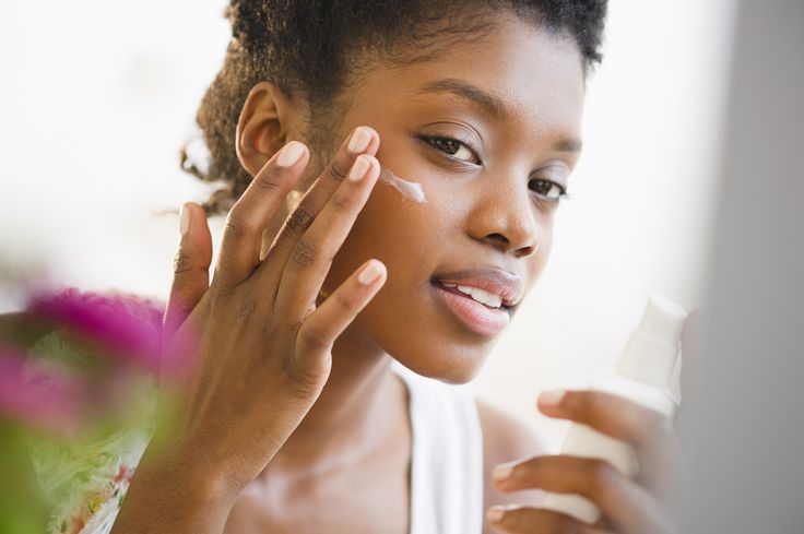 Woman Applying Creamy Cleanser