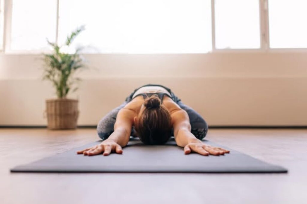 A woman doing the Child’s Pose Yoga