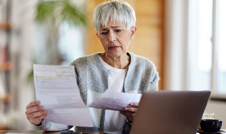 Aged woman updating personal information