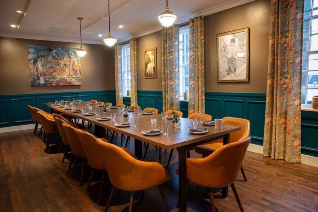 A long dining table with uniform chair sizes