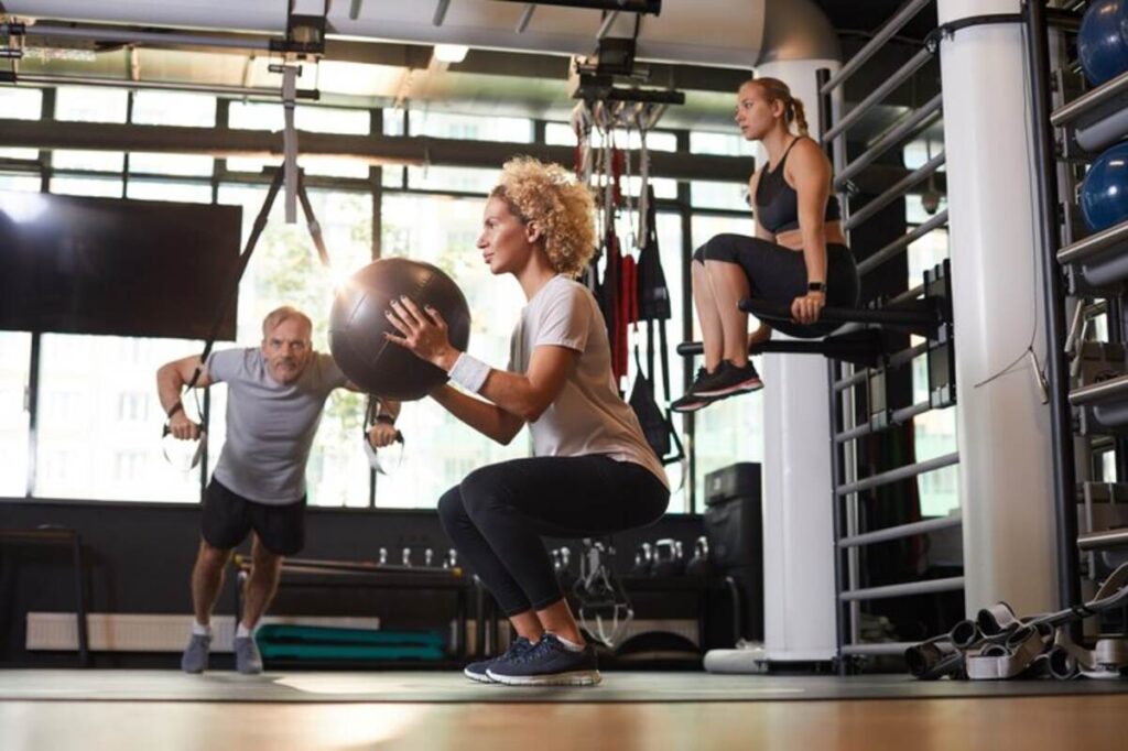 A couple of people using a public training facility