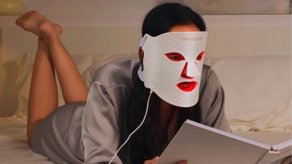 Woman Using a LED Light Therapy Face Mask