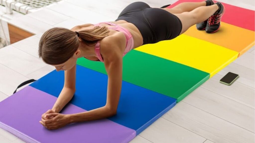 Woman planking on a workout mat