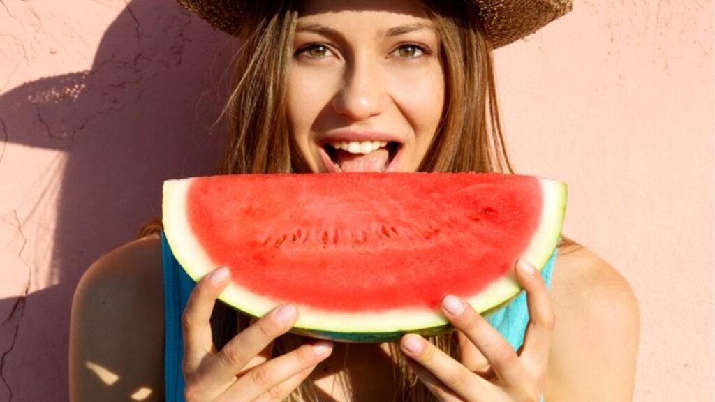 Woman eating watermelon