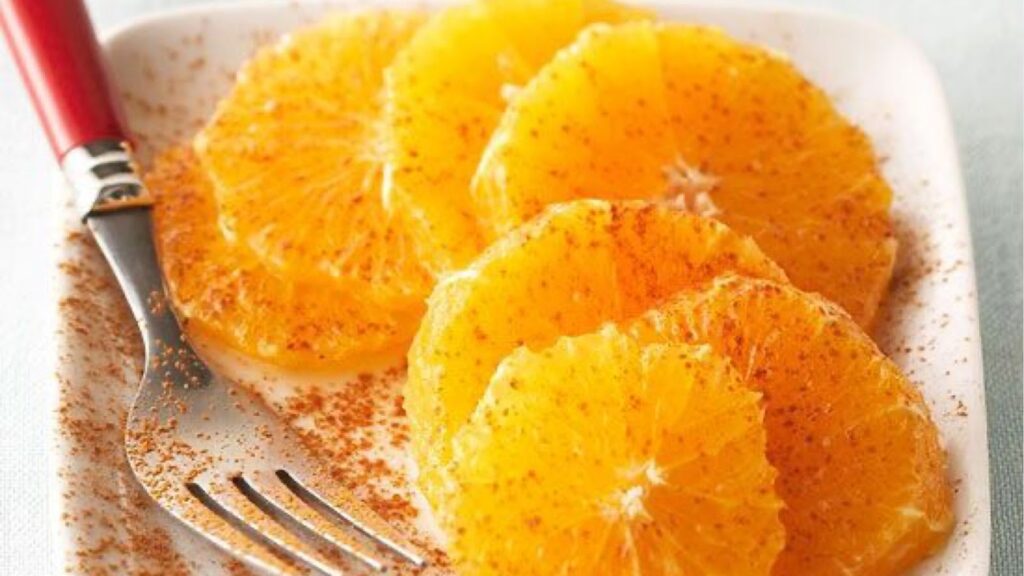 Oranges in a white plate