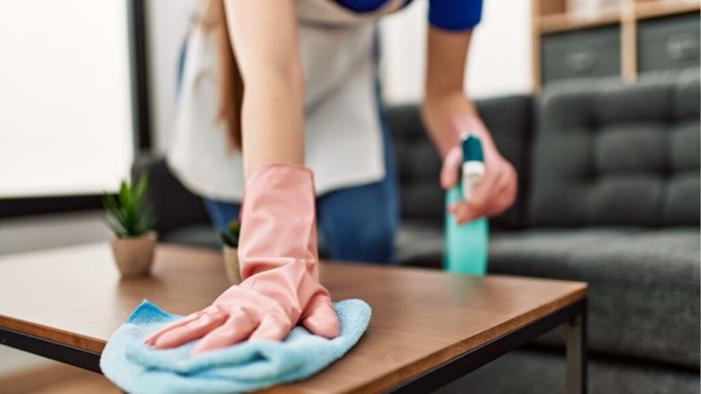 Woman cleaning a center table