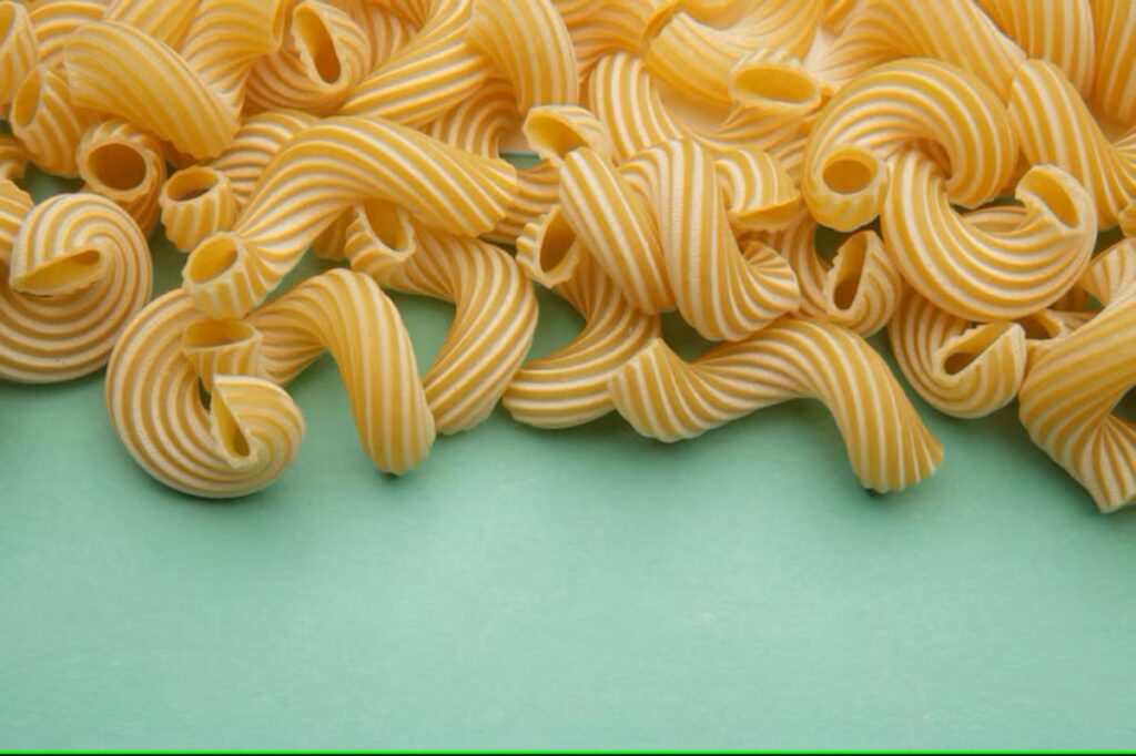 Spiral pasta on a blue table