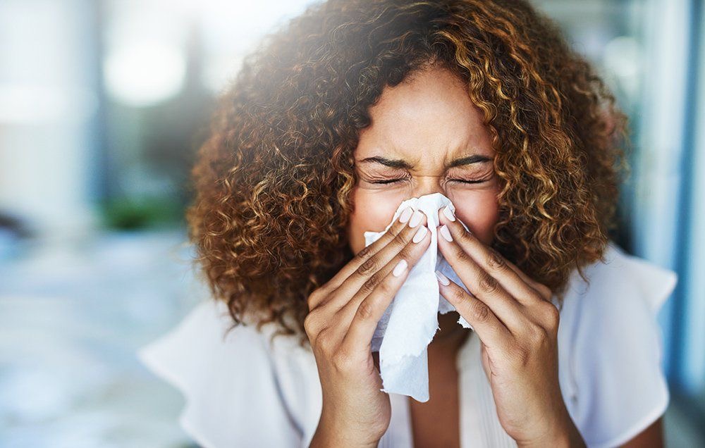 A woman with a runny nose