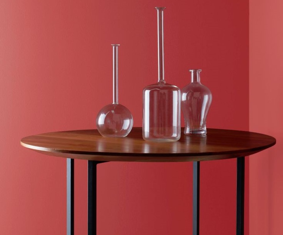 Decorative glassware sitting atop a piece of furniture