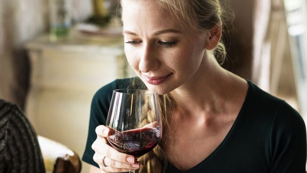 Woman drinking red wine