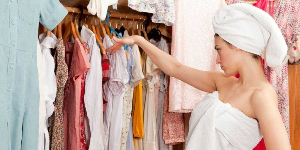 Rummaging a closet for an outfit to wear