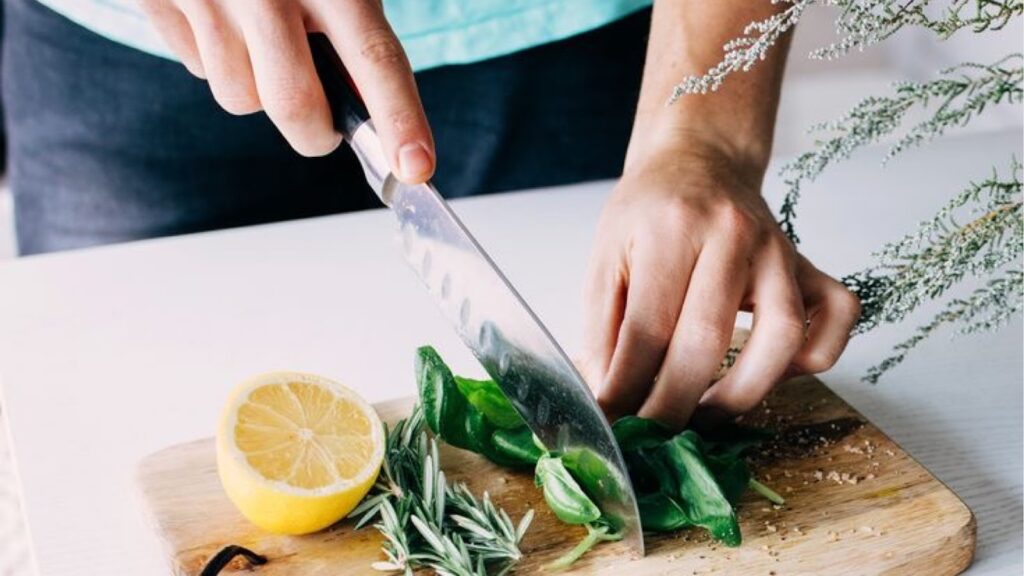 Woman chopping fresh spices