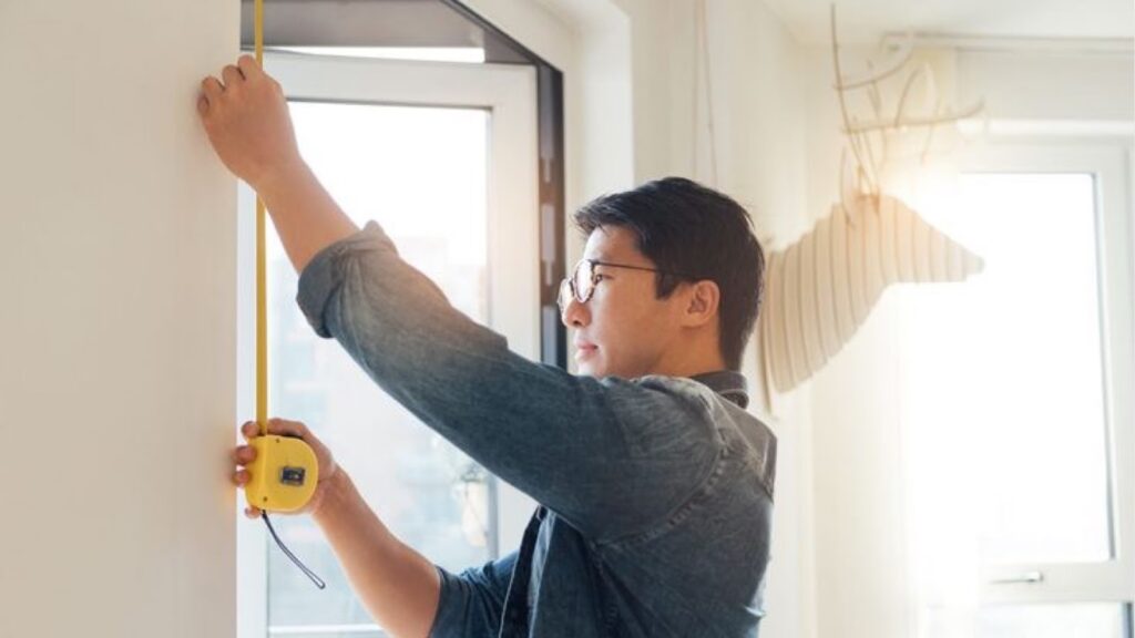 Man Measuring Furniture